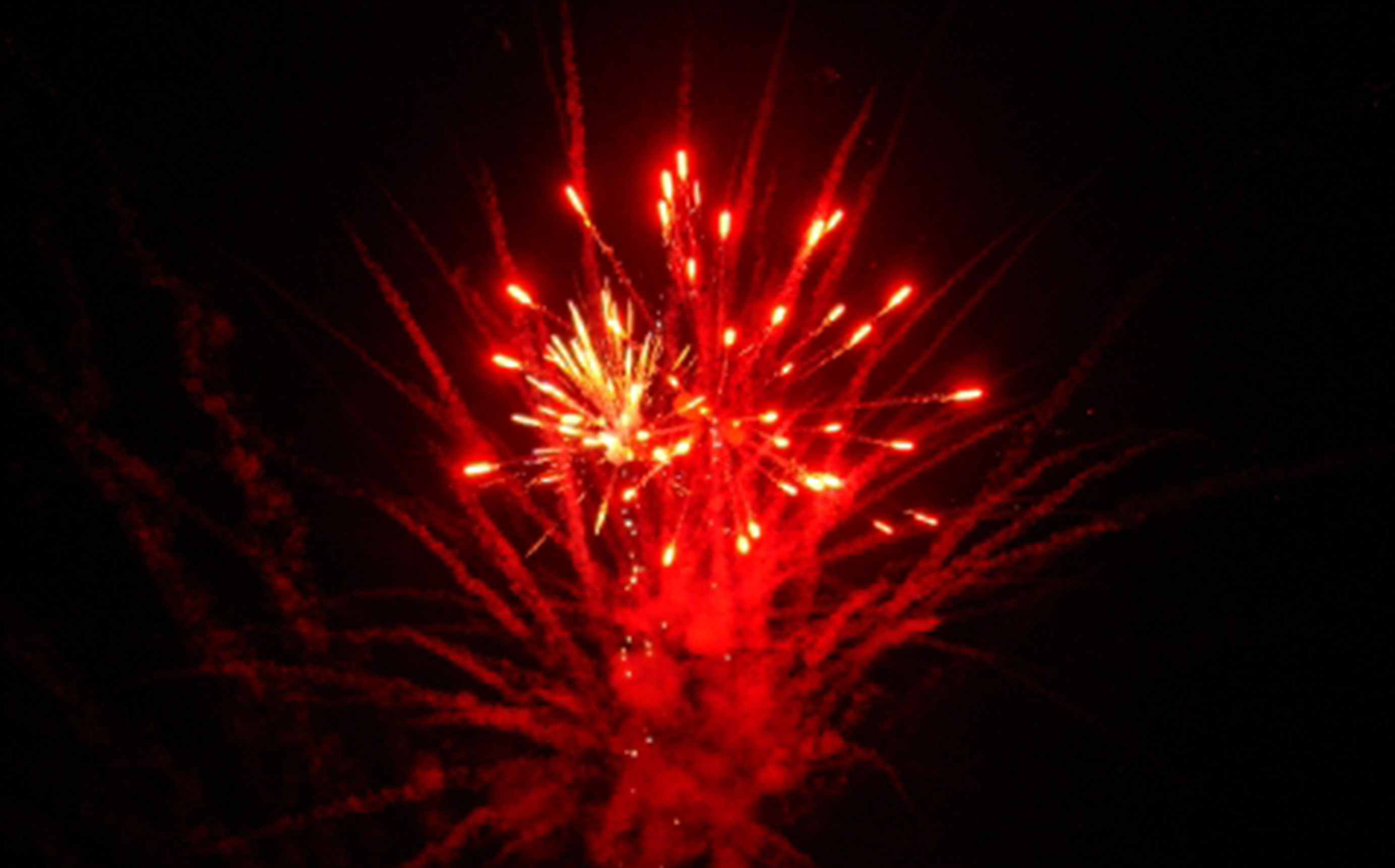 A Fireworks Solutions Limited display, a large scale display with bright red fireworks
