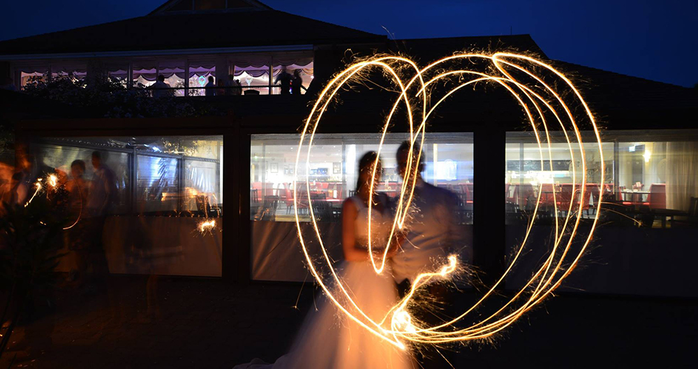 A wedding couple enjoying fireworks on their special day